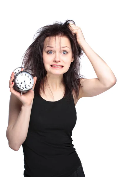 Stressed young woman with clock on white — Stock Photo, Image