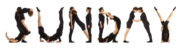 Black dressed people forming SUNDAY word — Stock Photo, Image