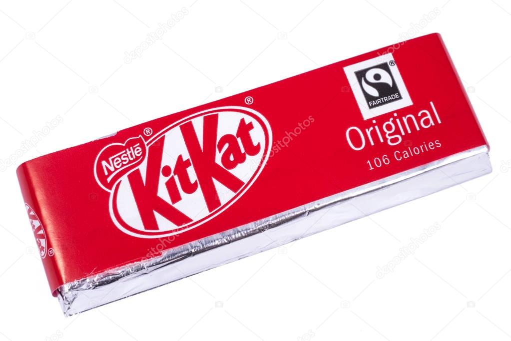 LONDON, UK - JANUARY 4TH 2017: An unopened Kit Kat chocolate bar manufactured by Nestle, pictured over a plain white background on 4th January 2017.