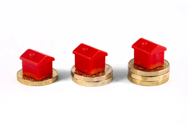 Red Houses Sitting on top of Savings — Stock Photo, Image