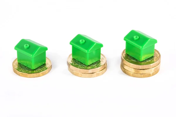 Green Houses Sitting on top of Savings — Stock Photo, Image