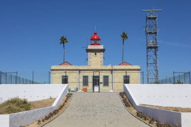Lighthouse at Ponta da Piedade in Portugal clipart
