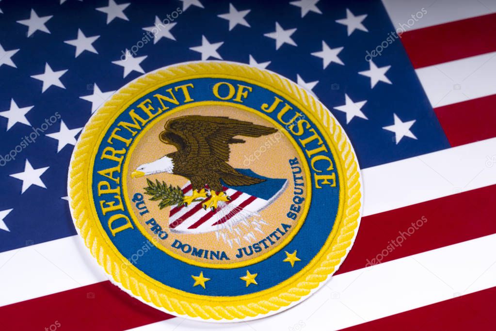 LONDON, UK - MARCH 26TH 2018: The symbol of the United States Department of Justice portrayed with the US flag, on 26th March 2018.