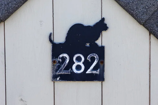 Zwarte kat 282 nummer Plaque — Stockfoto