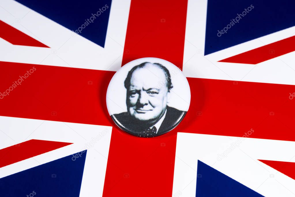 London, UK - November 21st 2019: A pin badge with a portrait of famous Briton Sir Winston Churchill, pictured over the flag of the United Kingdom.