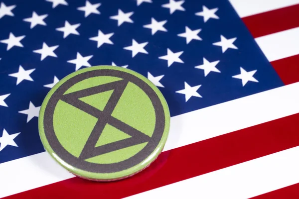 Symbole de rébellion d'extinction et drapeau des États-Unis — Photo