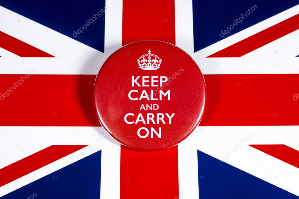London, UK - November 22nd 2019: Keep Calm and Carry On symbol, pictured over the flag of the United Kingdom.