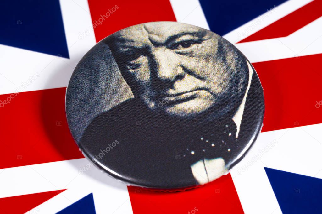London, UK - November 22nd 2019: A badge with a portrait of Sir Winston Churchill, pictured over the flag of the United Kingdom.