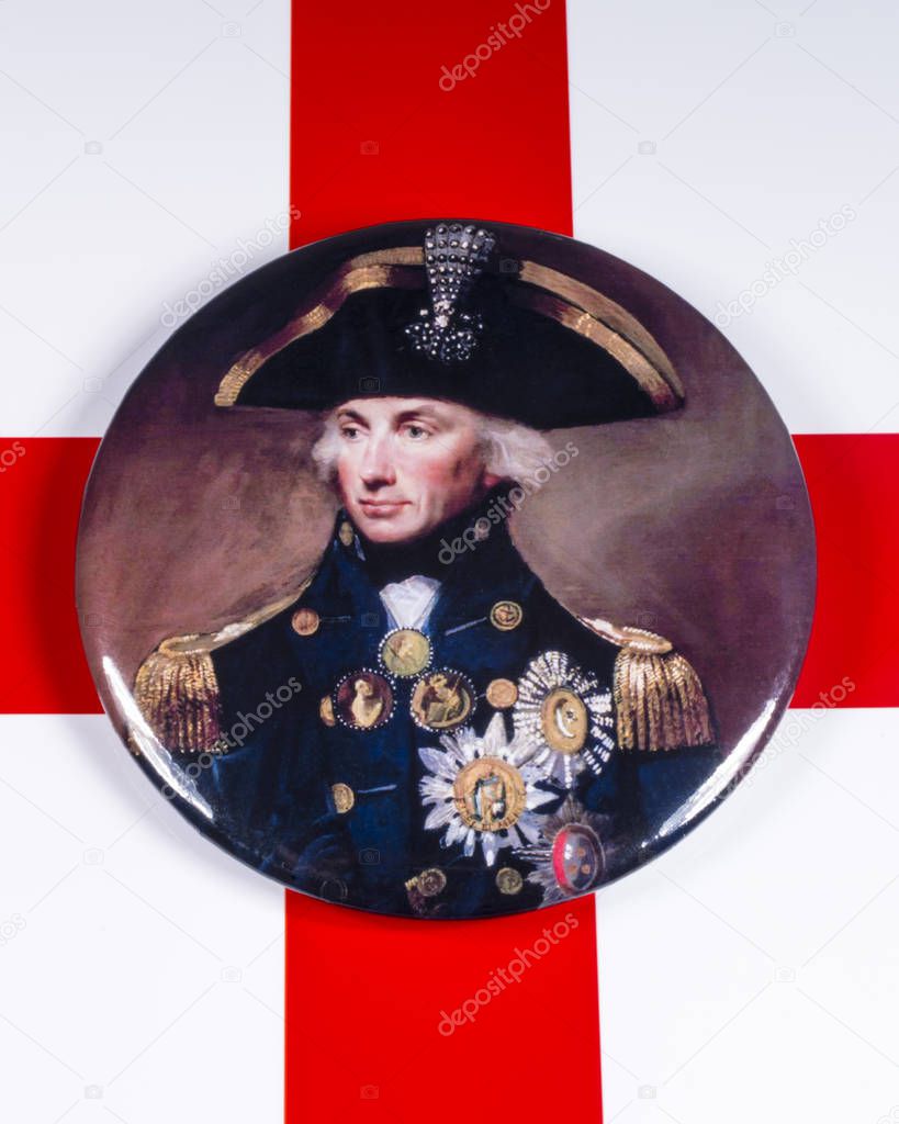 London, UK - December 3rd 2019: A pin badge with a portrait of Horatio Nelson - the famous Naval officer, pictured over the flag of England.
