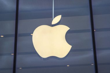 Dusseldorf, Germany - February 18th 2020: The Apple logo above the entrance to one of their stores in the city of Dusseldorf, Germany. clipart