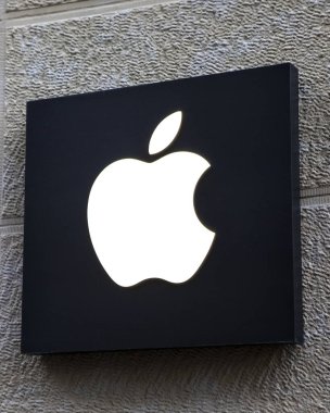 Cologne, Germany - February 19th 2020: The Apple logo, above the entrance to one of their stores in the city of Cologne, Germany.