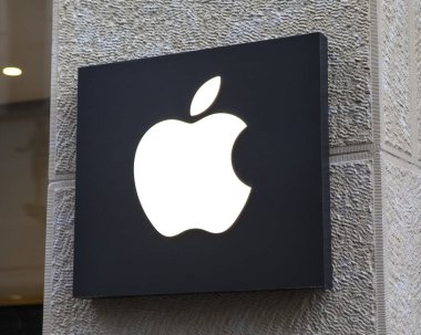 Cologne, Germany - February 19th 2020: The Apple logo, above the entrance to one of their stores in the city of Cologne, Germany.