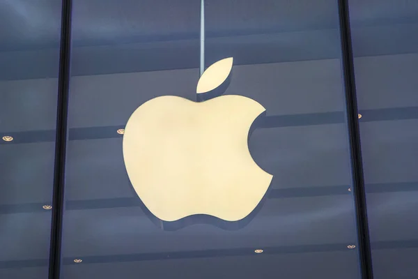 stock image Dusseldorf, Germany - February 18th 2020: The Apple logo above the entrance to one of their stores in the city of Dusseldorf, Germany.