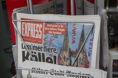 Cologne, Germany - February 20th 2020: The front page of the EXPRESS German newspaper with the headline Let us Celebrate - marking the beginning of the 2020 Cologne Carnival in Germany.
