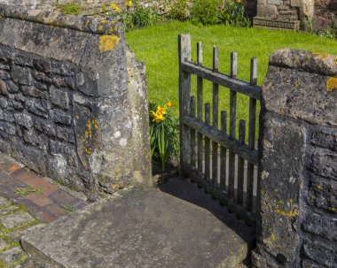 A gateway on the beautiful Vicars Close in the city of Wells in Somerset, UK.  It is claimed to be the oldest purely residential street with original surviving buildings in Europe. clipart