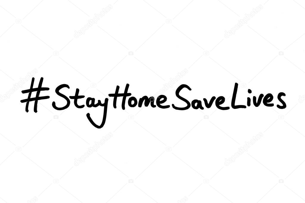 Hashtag Stay Home Save Lives handwrotten on a white background.