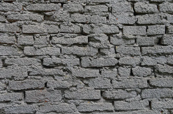 De bakstenen muur is bedekt met cement — Stockfoto