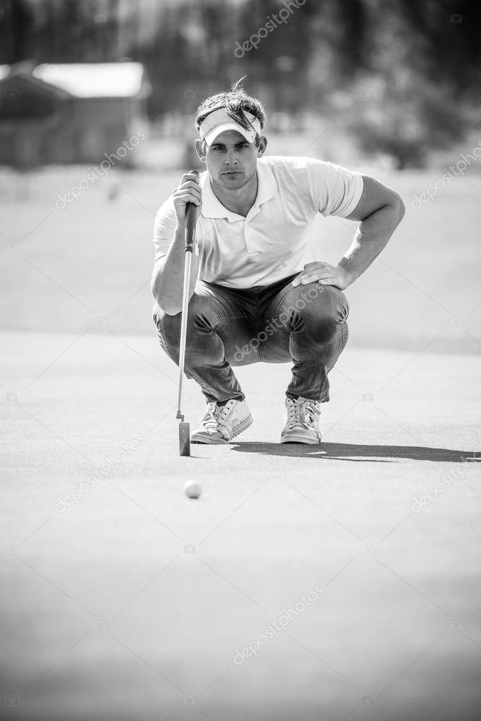 golfer planning his shot to the pin