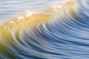 Waves on the ocean captured with a slow shutter clipart
