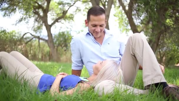 Young  couple on a summer day in a park. — Stock Video