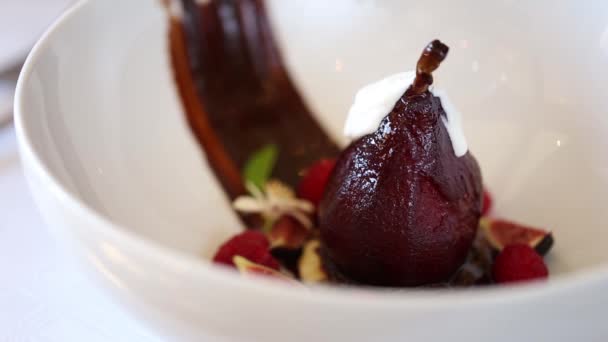 Delicious poached pear with whipped cream — Stock Video