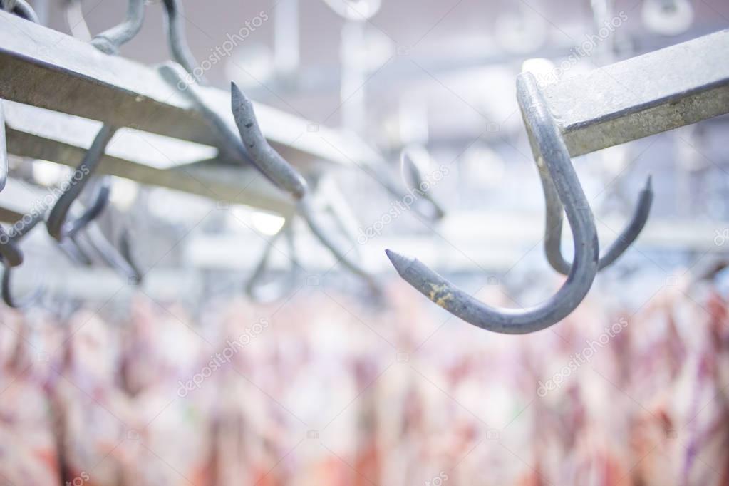 meat hooks in a slaughterhouse