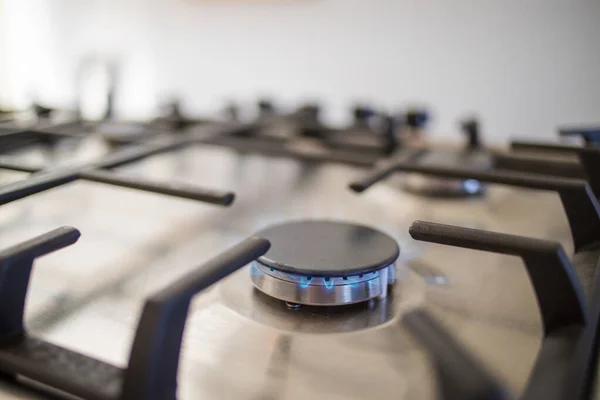 Close up image of a gas burner on a gas stove