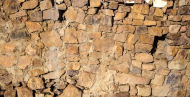 Kırsal bir çiftlikteki eski bir taş duvarın dokusu