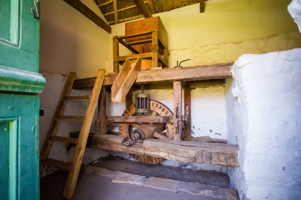 Close up image of an antique stone mill