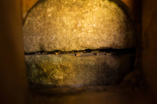 Close up image of an antique stone mill