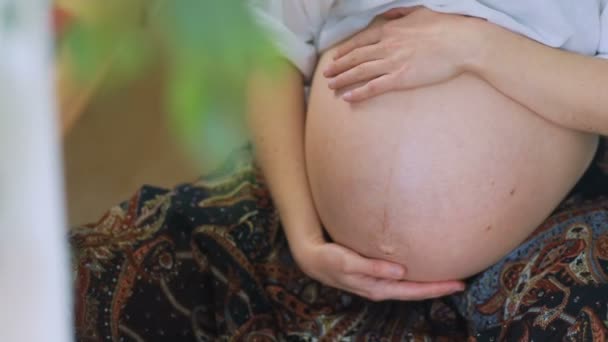 Pregnant woman touching belly — Stock Video