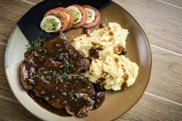 Beef steak meal with mashed potato and gravy sauce — Stock Photo, Image