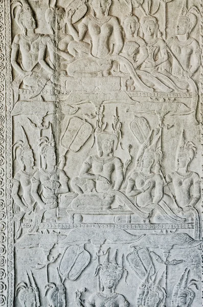 Antica pietra asiatica figure intagliate in angkor wat tempio cambogia — Foto Stock