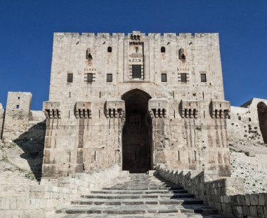 citadel fortress gate landmark in central old aleppo city syria clipart