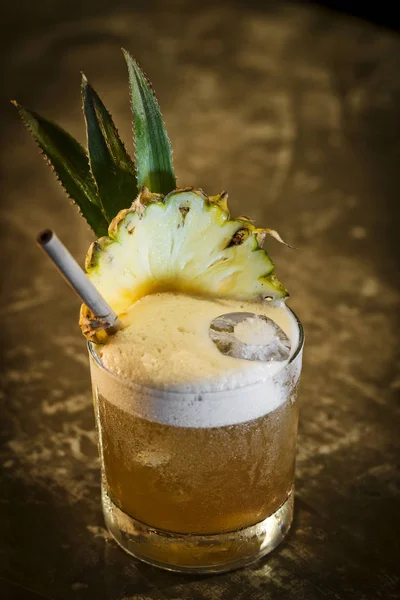 Pineapple mango tropical rum cocktail drink in bar — Stock Photo, Image