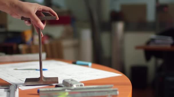 Hand placing structure on desk — Stock Video