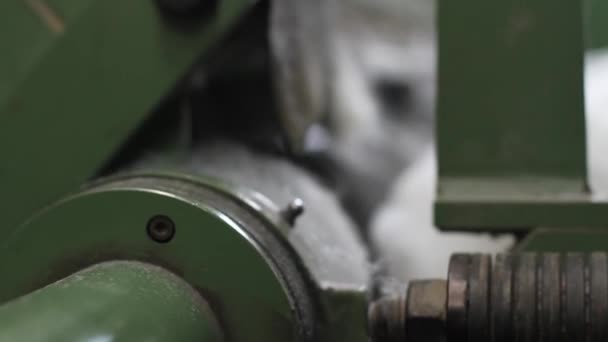 Close up on cotton-rolling machine — Stock Video