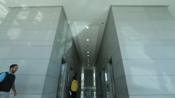Man walks towards the elevators — Stock Video