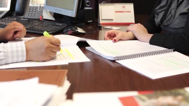 Workers reviewing documents — Stock Video