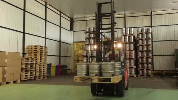 Forklift with kegs in warehouse — Stock Video