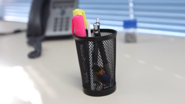 Pencil holder on an office desk — Stock Video