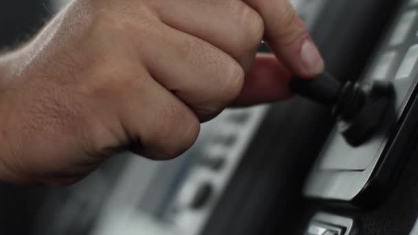 Hand guiding knob on control panel — Stock Video