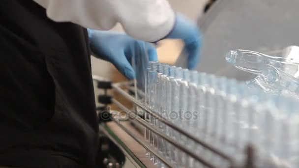 Clear plastic bottles on assembly line — Stock Video