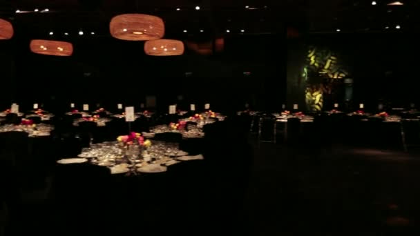 Event room in the dark, with party lights — Stock Video