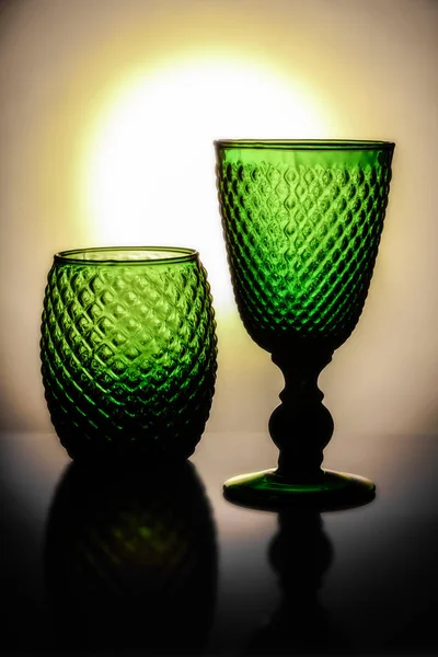 Gorgeous green wine cups with a bright sun on the background — Stock Photo, Image