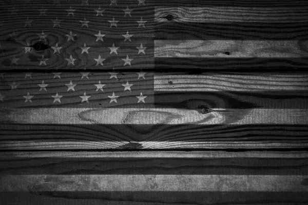 Vintage American Flag painted on an aged, weathered rustic wooden Background.