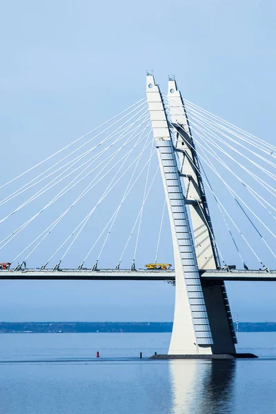 Cable-Stayed Bridge with auto cranes at sunny spring day.