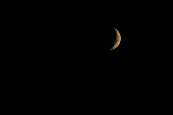 Waxing Crescent phase of the Moon in the black sky background — Stock Photo, Image