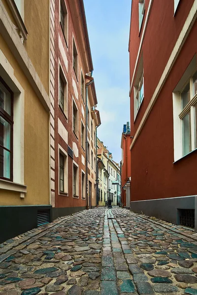 Old medieval morning narrow street in Riga, Latvia. Retro styled. — Stock Photo, Image