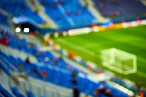 Empty blue green football soccer field stadium. Soft focus blurred background Stock Photo